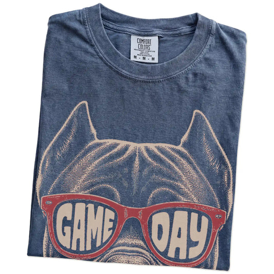 Folded Denim Comfort Colors® T-shirt showing cane corso wearing red game day sunglasses