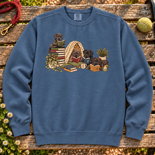 Cane Corso puppies reading books in a cozy blanket fort on a Denim sweatshirt