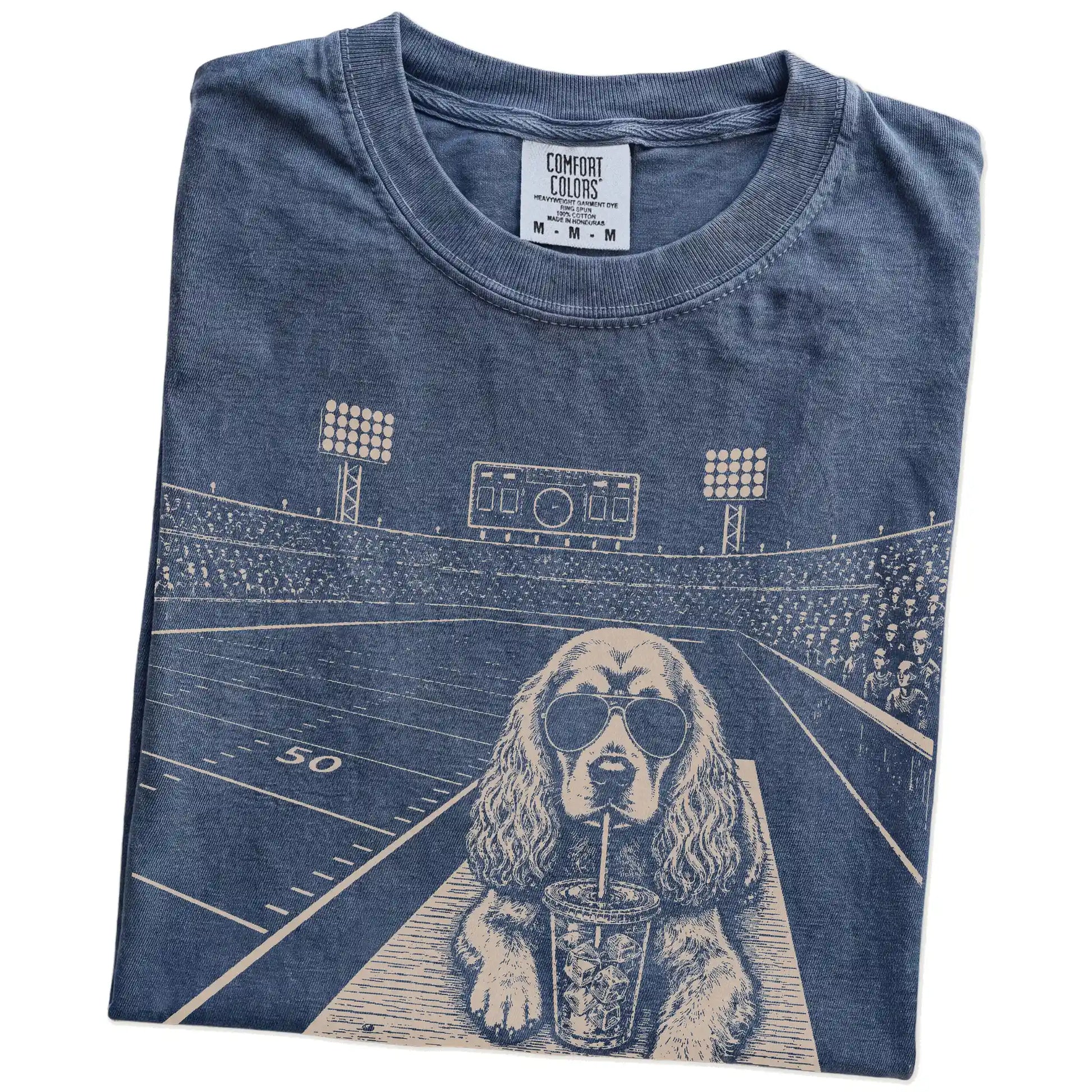 Folded Denim Comfort Colors® T-shirt showing Cocker Spaniel ready for football and tailgate season