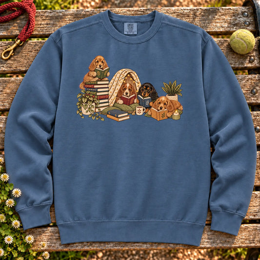 Cocker Spaniel puppies reading books in a cozy blanket fort on a Denim sweatshirt