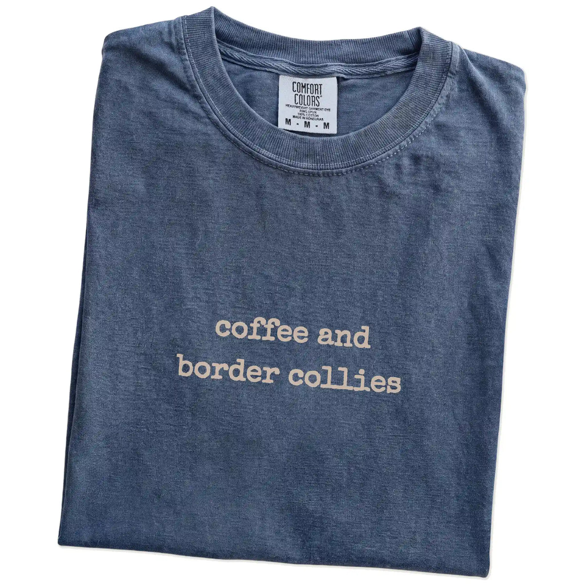 Folded Denim Comfort Colors® T-shirt showing “coffee and border collies” retro text