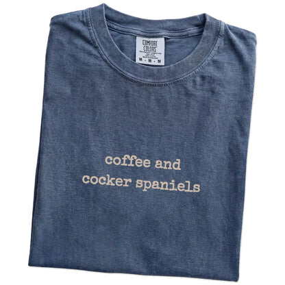 Folded Denim Comfort Colors® T-shirt showing “coffee and cocker spaniels” retro text