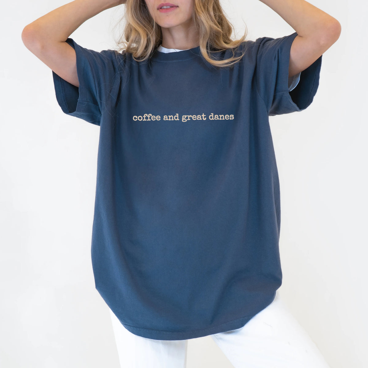Model wearing a Denim Comfort Colors® T-shirt with “coffee and great danes” retro text