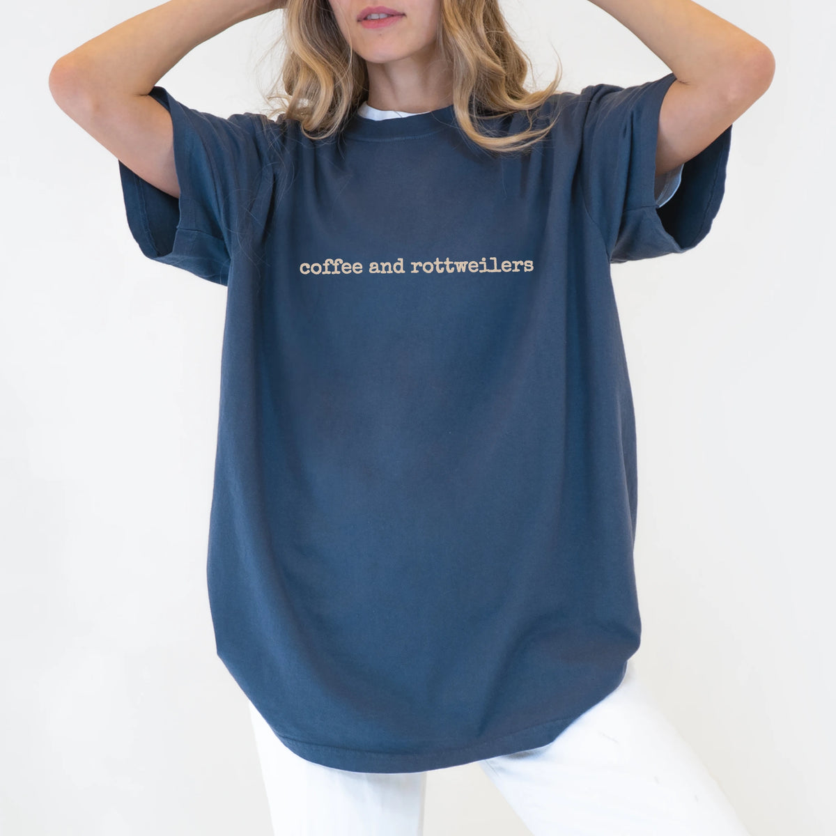 Model wearing a Denim Comfort Colors® T-shirt with “coffee and rottweilers” retro text