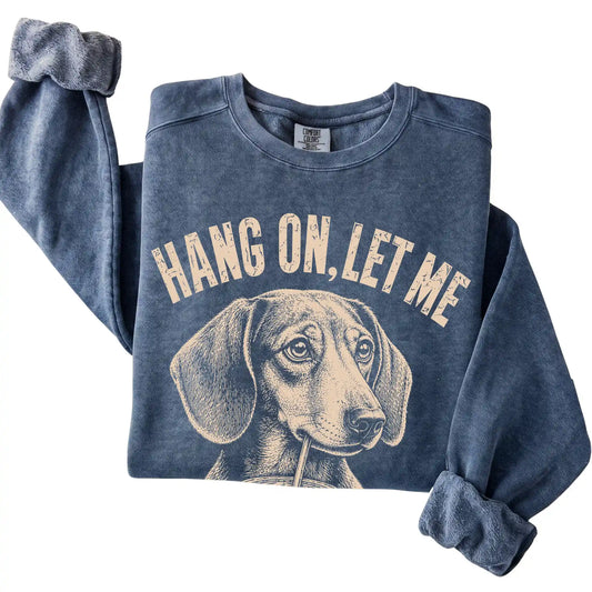 Denim Comfort Colors sweatshirt featuring Dachshund Iced Coffee Overthink, folded presentation