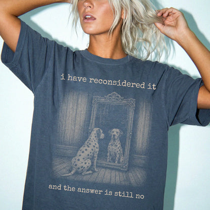 Model wearing a Denim Comfort Colors® T-shirt with “the answer is still no” dalmatian design
