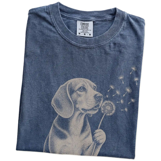 Folded Denim Comfort Colors® T-shirt showing Beagle portrait with drifting dandelion seeds