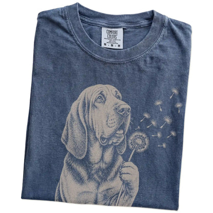 Folded Denim Comfort Colors® T-shirt showing Bloodhound portrait with drifting dandelion seeds
