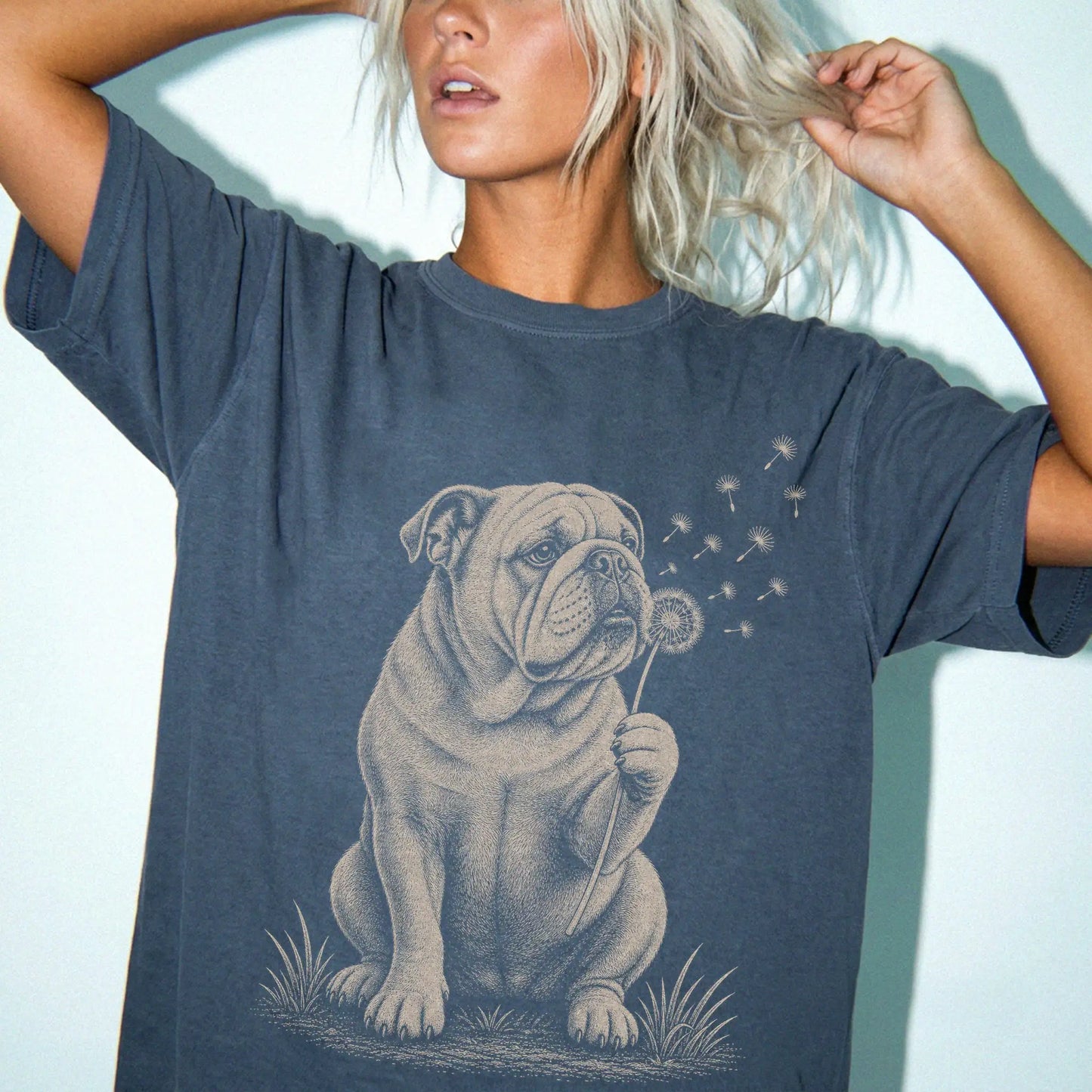 Model wearing a Denim Comfort Colors® T-shirt showing Bulldog portrait with drifting dandelion seeds