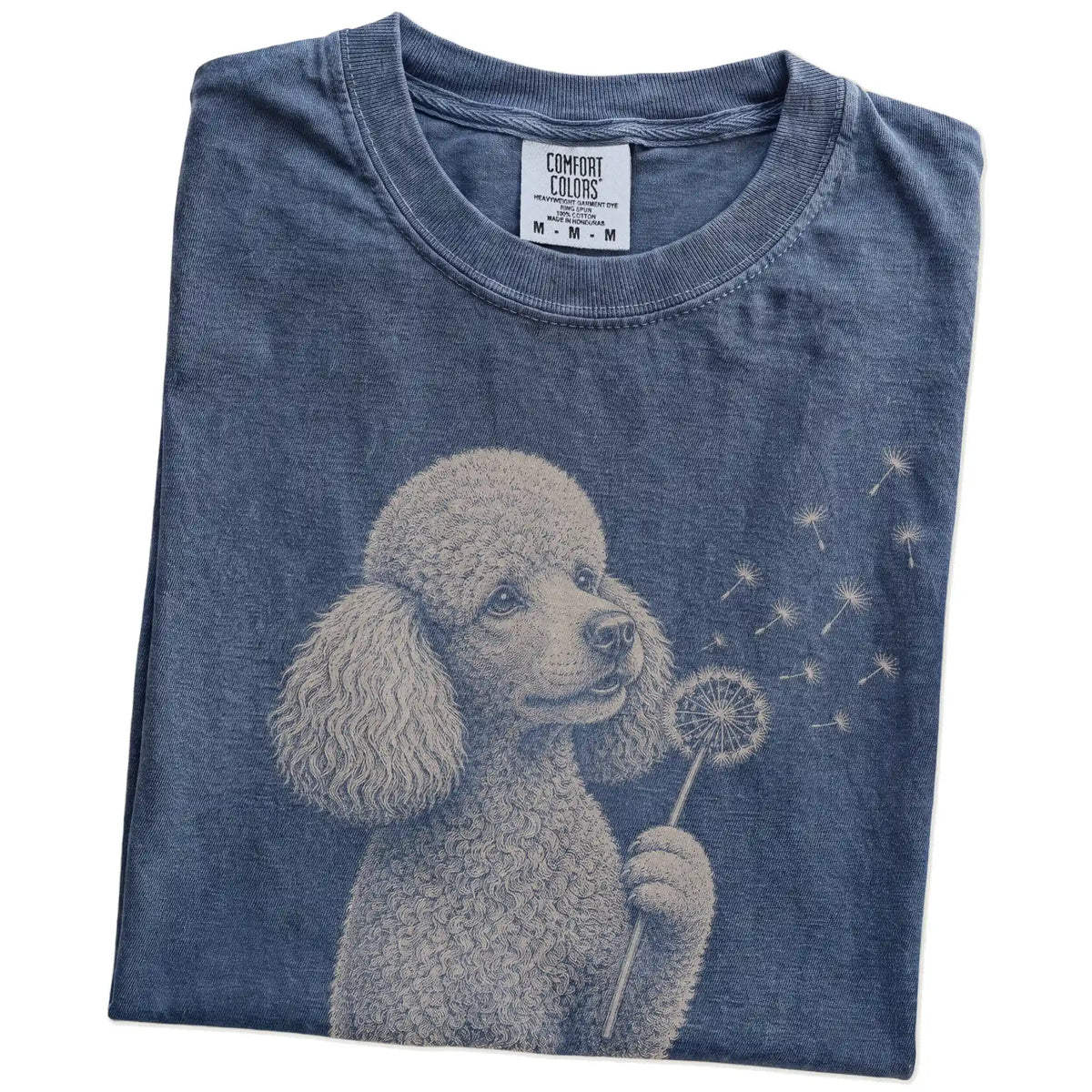 Folded Denim Comfort Colors® T-shirt showing Poodle portrait with drifting dandelion seeds