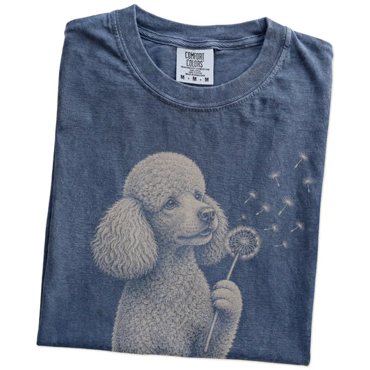 Folded Denim Comfort Colors® T-shirt showing Poodle portrait with drifting dandelion seeds