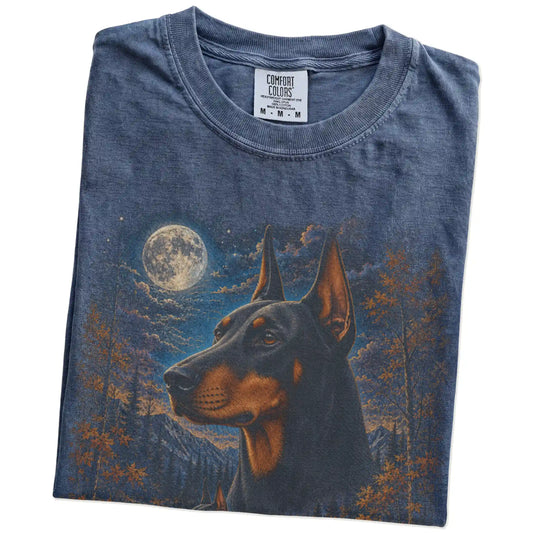 Folded denim T-shirt with Doberman Autumn Moon artwork.