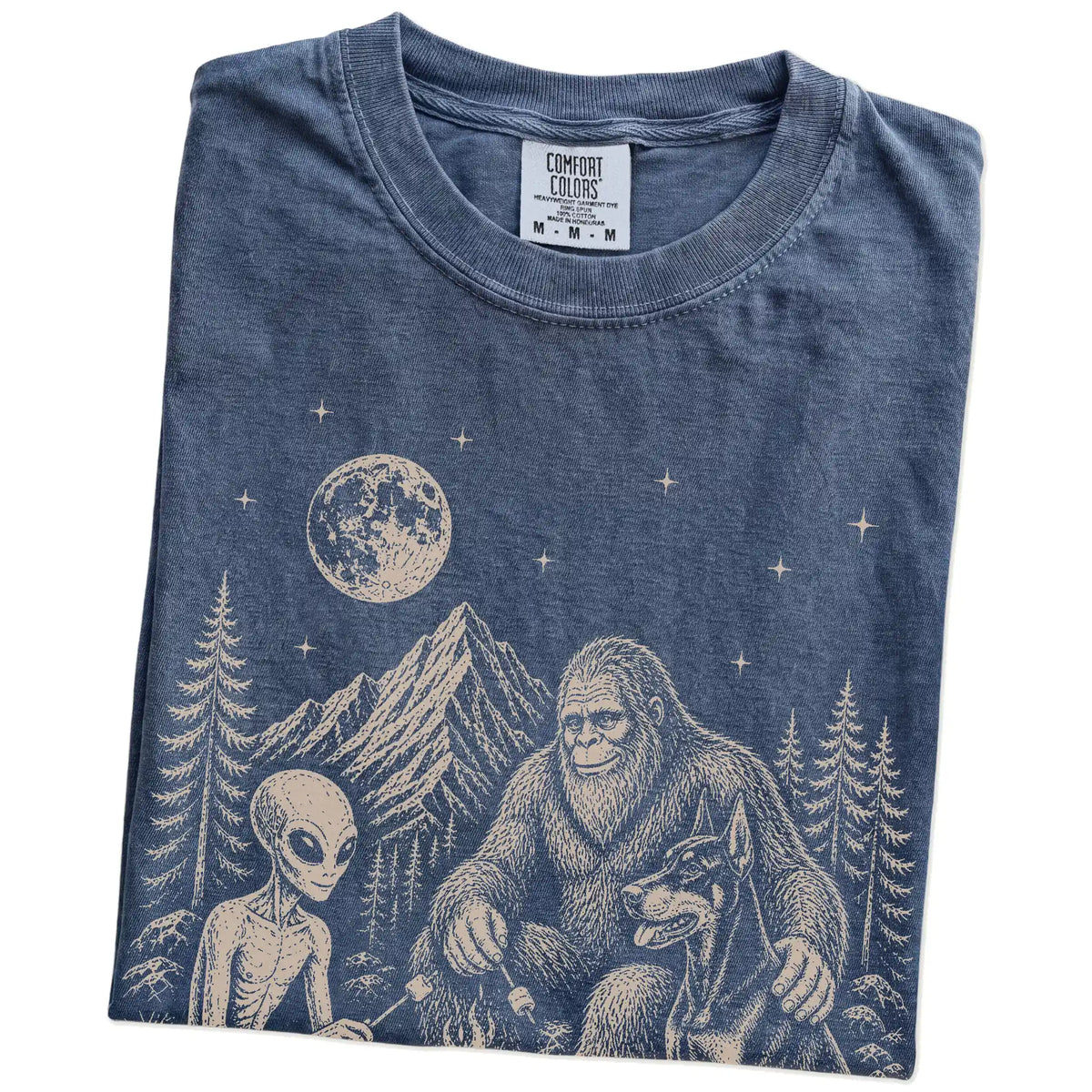 Folded Denim Comfort Colors® T-shirt showing Doberman camping with Bigfoot and an alien