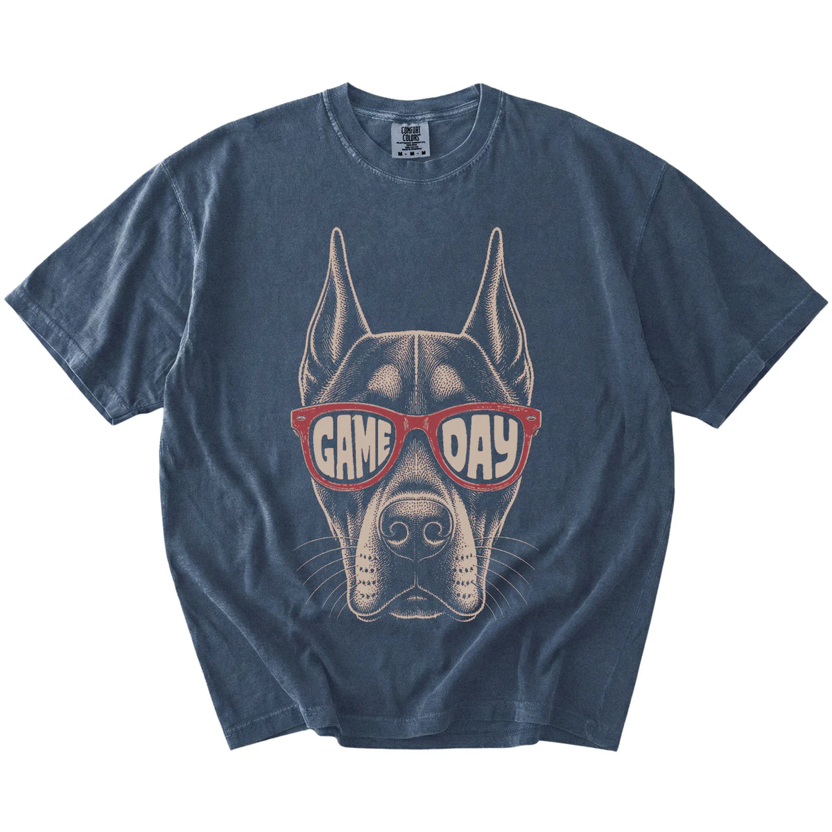Doberman wearing red Game Day sunglasses on a Denim Comfort Colors® T-shirt