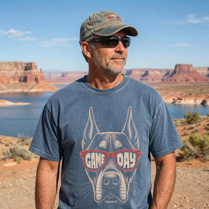 Model wearing a Denim Comfort Colors® T-shirt with doberman wearing red game day sunglasses