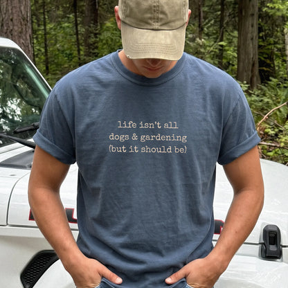 Model wearing a Denim Comfort Colors® T-shirt showing dog-themed gardening graphic
