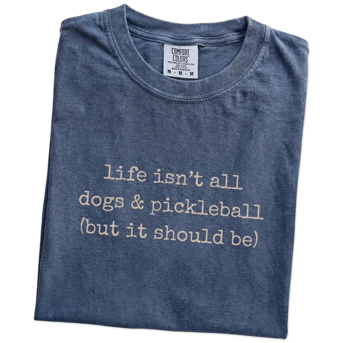 Folded Denim Comfort Colors® T-shirt showing dog-themed pickleball graphic