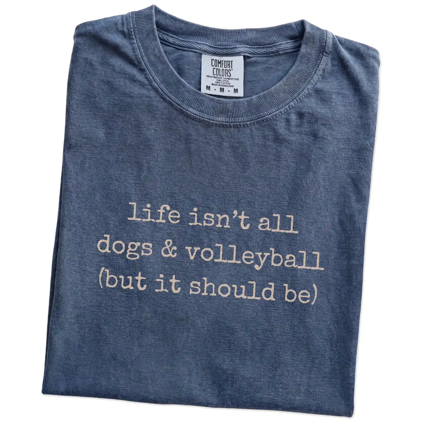 Folded Denim Comfort Colors® T-shirt showing dog-themed volleyball graphic