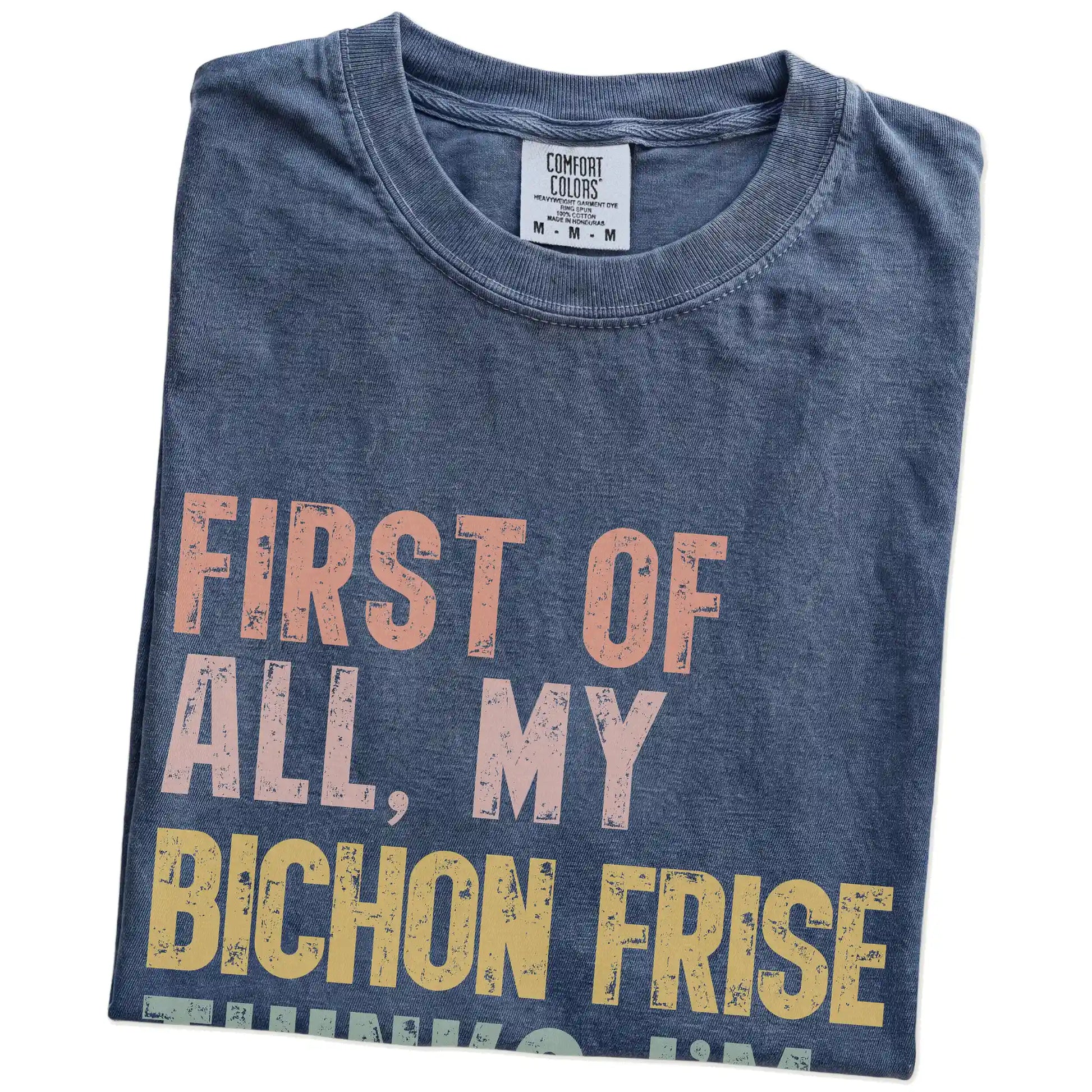 Folded Denim Comfort Colors® T-shirt showing “My Bichon Frise thinks I’m delightful” text