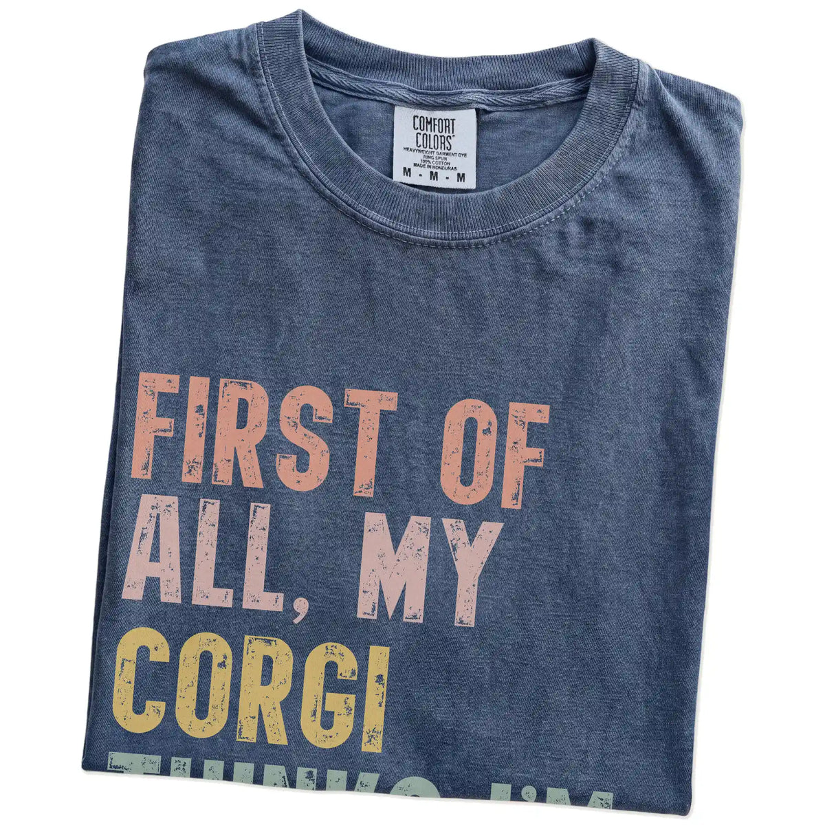 Folded Denim Comfort Colors® T-shirt showing “My Corgi thinks I’m delightful” text