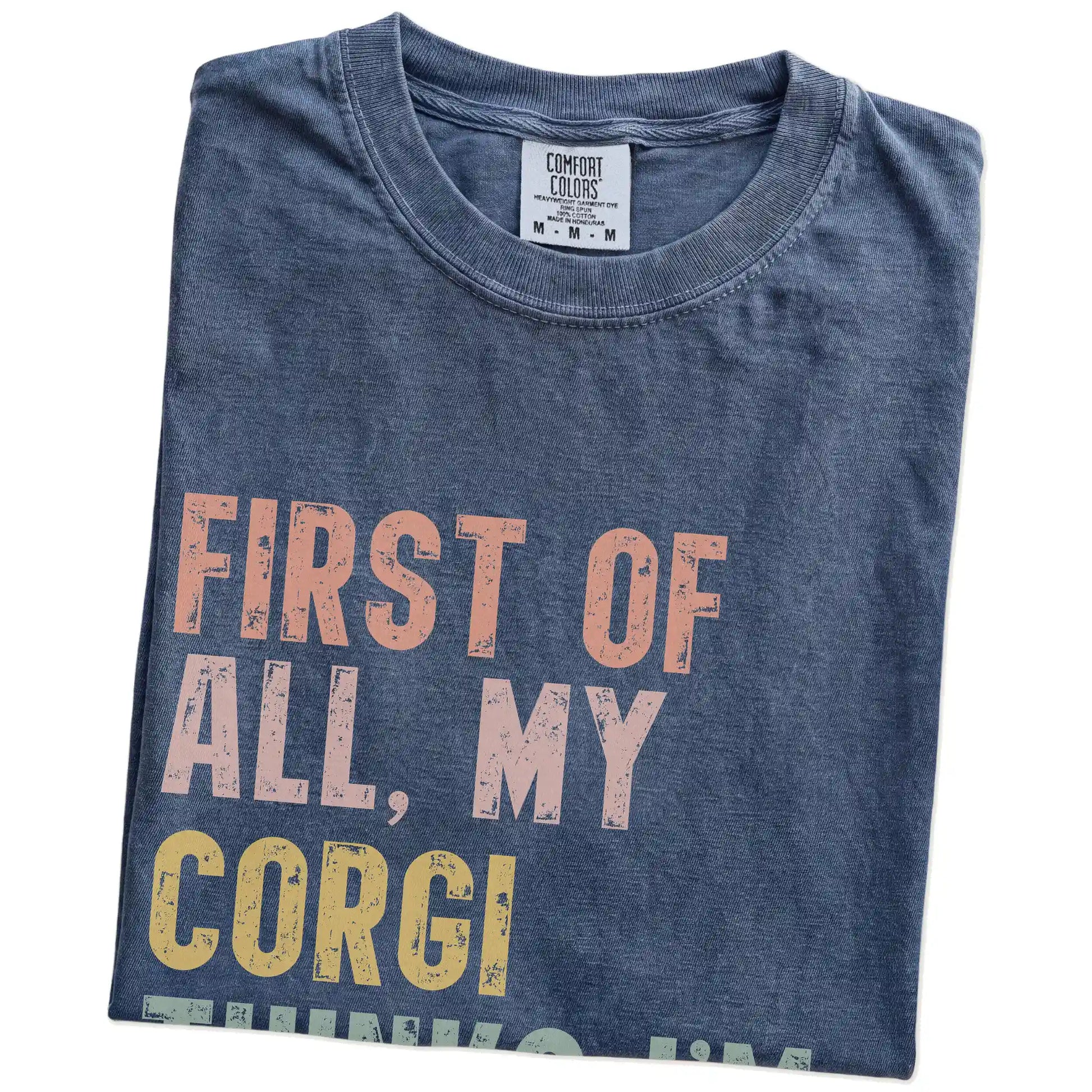 Folded Denim Comfort Colors® T-shirt showing “My Corgi thinks I’m delightful” text