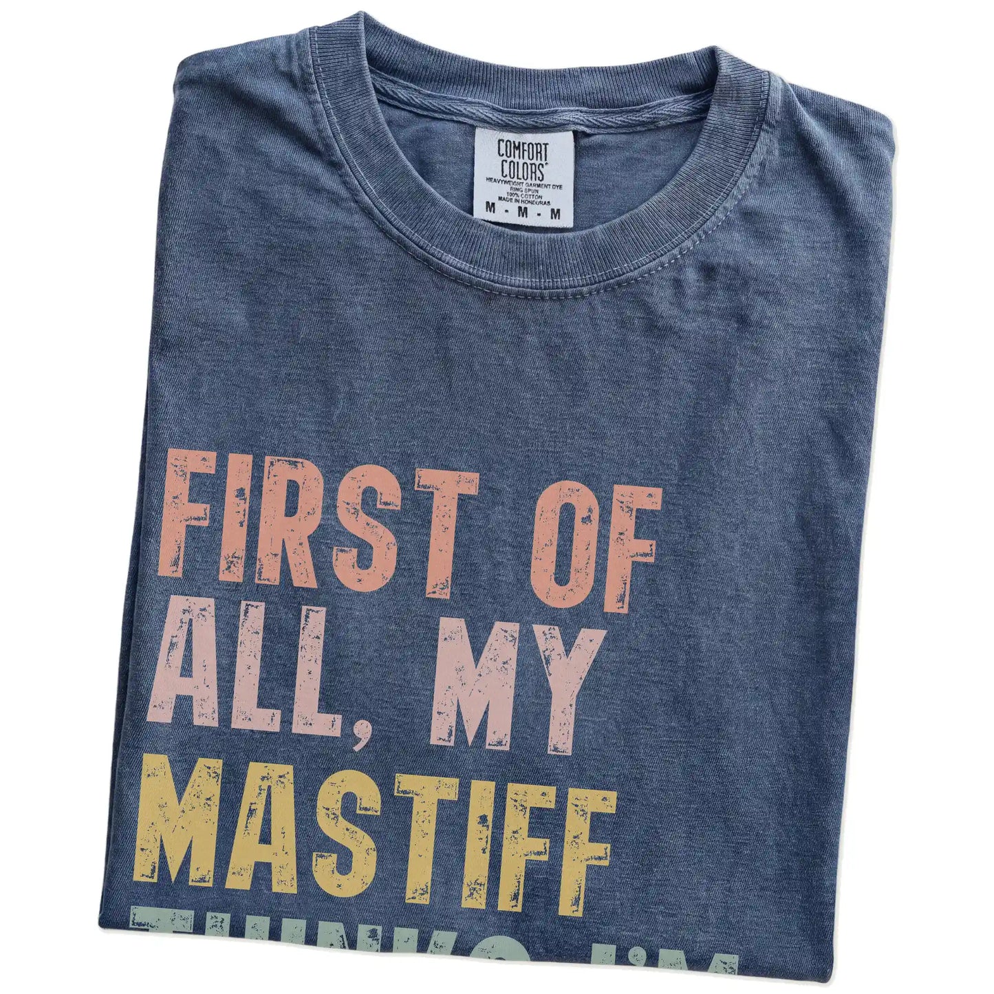 Folded Denim Comfort Colors® T-shirt showing “My Mastiff thinks I’m delightful” text