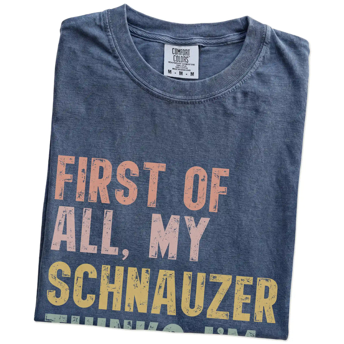Folded Denim Comfort Colors® T-shirt showing “My Schnauzer thinks I’m delightful” text