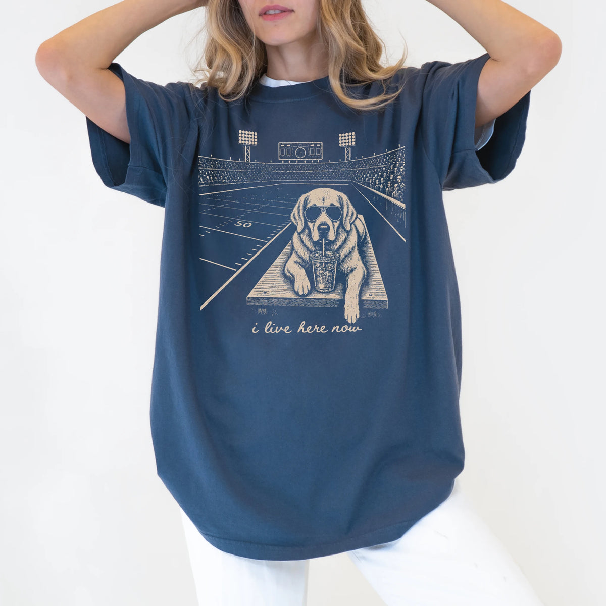 Model wearing a Denim Comfort Colors® T-shirt featuring Golden Retriever ready for football and tailgate season