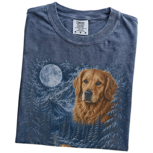 Folded denim T-shirt with Golden Retriever Winter Moon artwork.