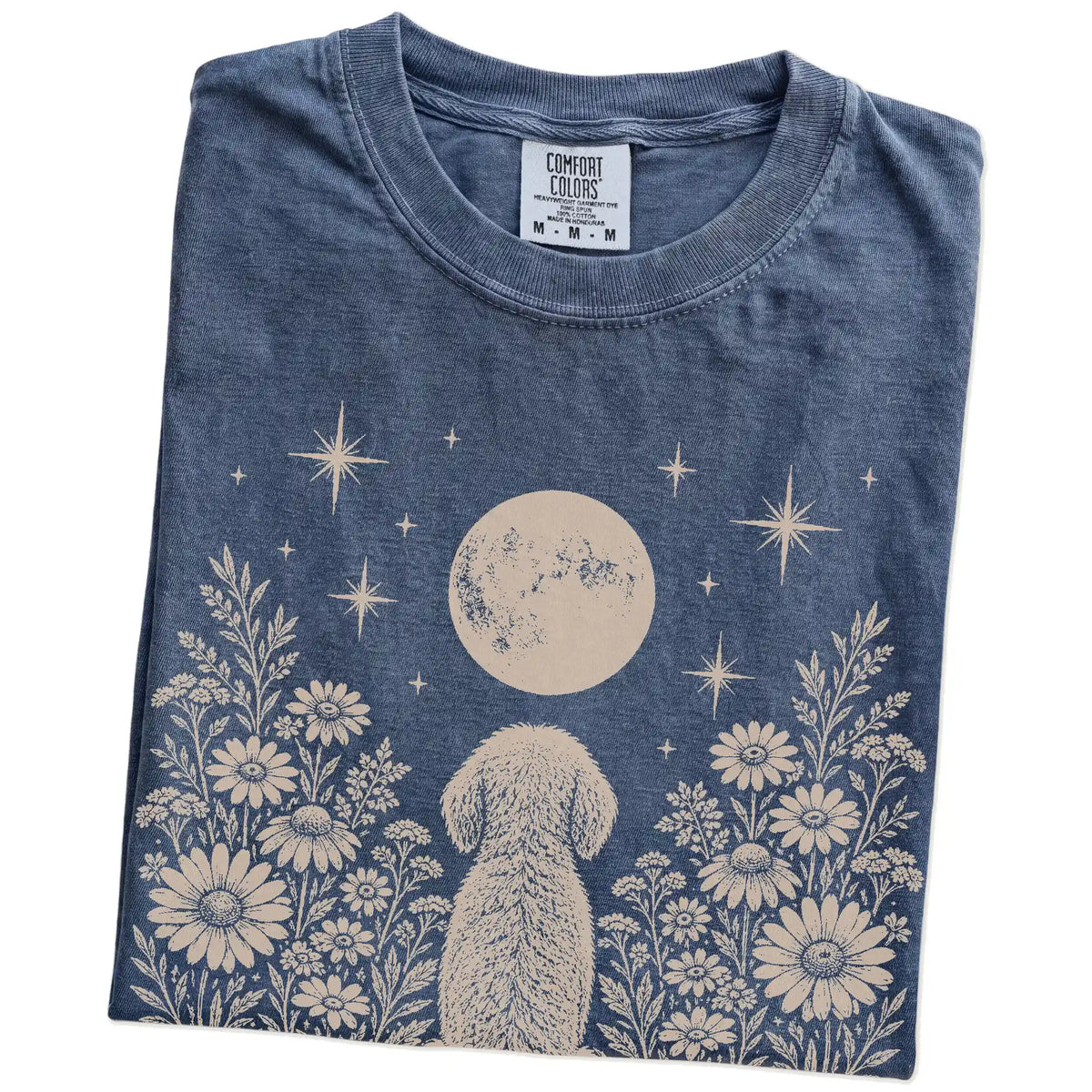 Folded Denim Comfort Colors® T-shirt showing Goldendoodle beneath a wildflower moon