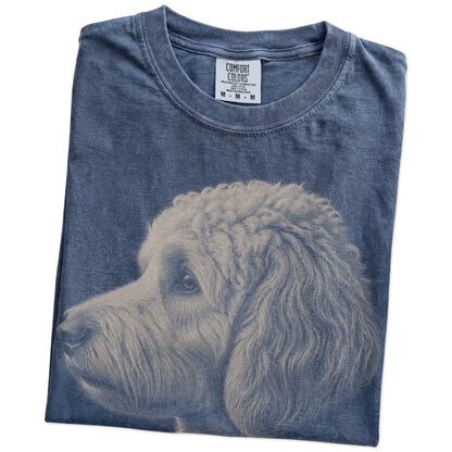 Folded Denim Comfort Colors® T-shirt showing a detailed photographic portrait of a Goldendoodle