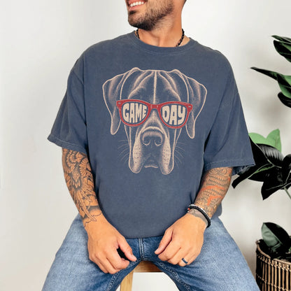 Model wearing a Denim Comfort Colors® T-shirt with great dane wearing red game day sunglasses