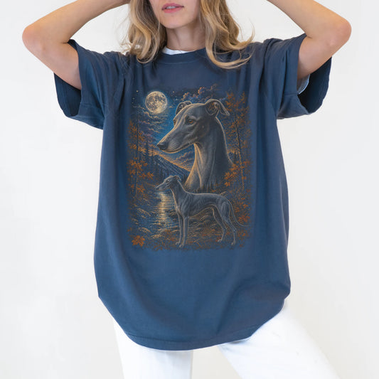 Model wearing a denim T-shirt with Greyhound Autumn Moon artwork.