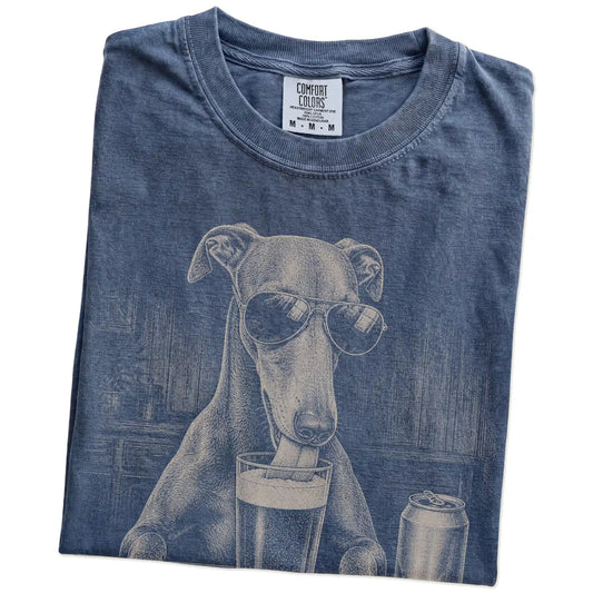 Folded Denim Comfort Colors® t-shirt showing Greyhound sneaking a drink from a pint