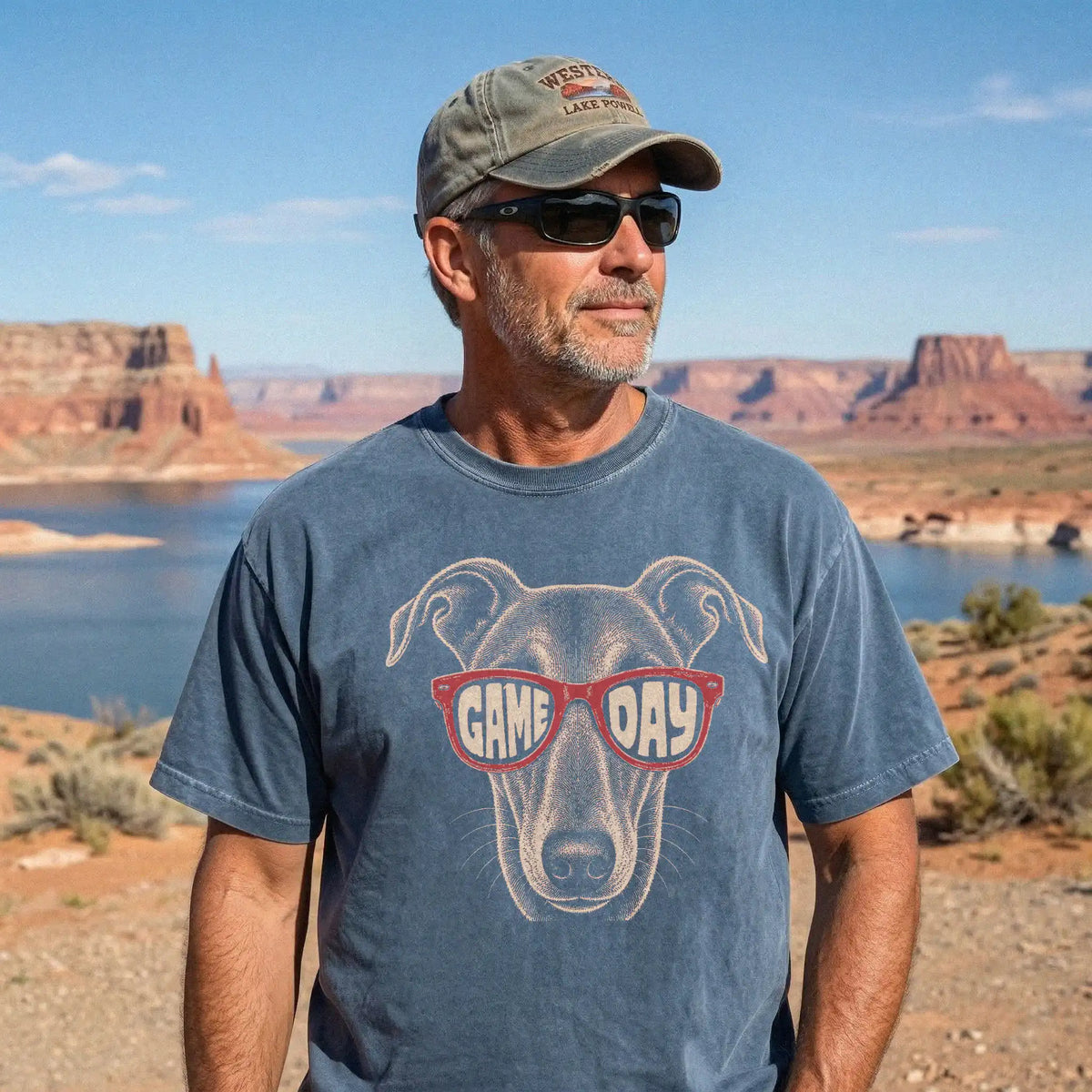 Model wearing a Denim Comfort Colors® T-shirt with greyhound wearing red game day sunglasses