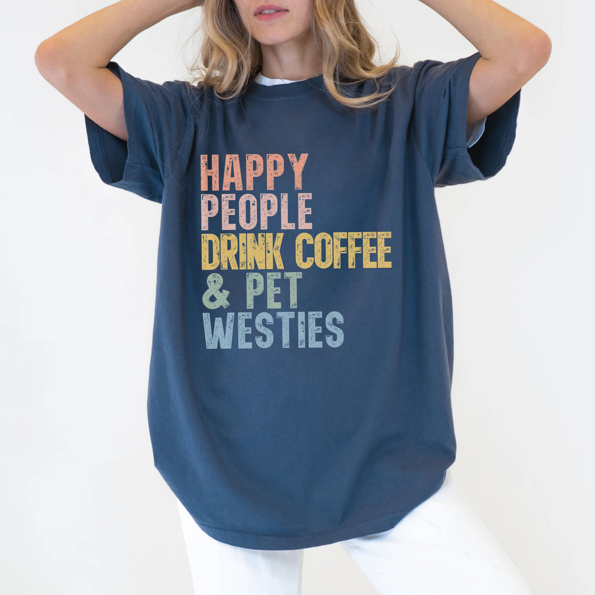 Model wearing a Denim Comfort Colors® T-shirt featuring Westie with coffee and “Happy People Drink Coffee and Pet Dogs” lette