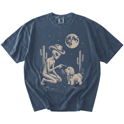 Cowboy alien fist-bumping a Havanese beneath the moon on a Denim Comfort Colors® T-shirt