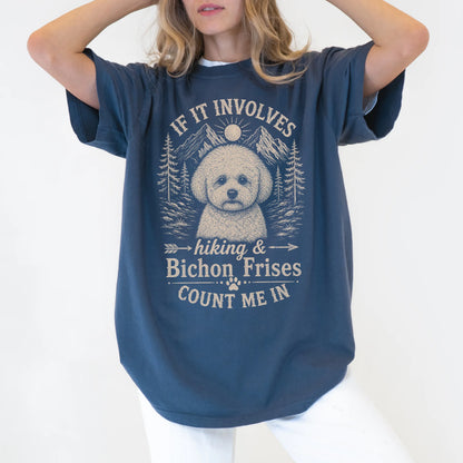 Model wearing a Denim Comfort Colors® T-shirt featuring Bichon Frise hiking design with mountain scenery