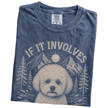 Folded Denim Comfort Colors® T-shirt showing Bichon Frise hiking design with mountain scenery