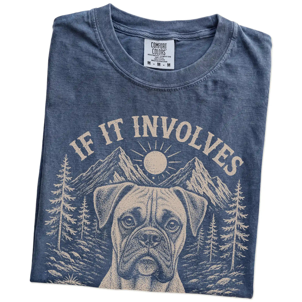 Folded Denim Comfort Colors® T-shirt showing Boxer hiking design with mountain scenery