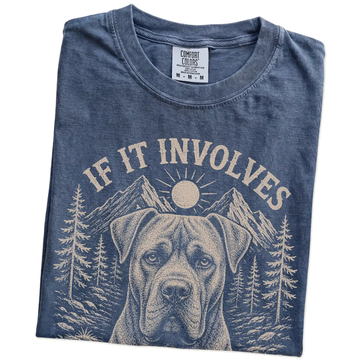 Folded Denim Comfort Colors® T-shirt showing Cane Corso hiking design with mountain scenery