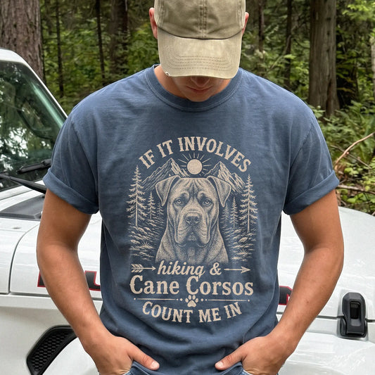 Model wearing a Denim Comfort Colors® T-shirt featuring Cane Corso hiking design with mountain scenery