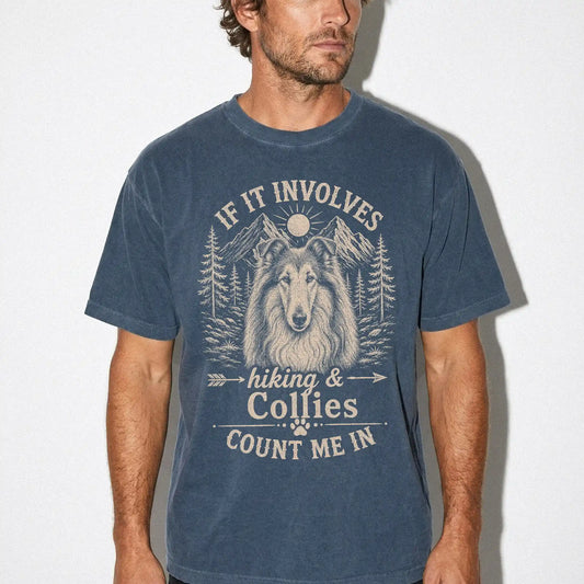Model wearing a Denim Comfort Colors® T-shirt featuring Collie hiking design with mountain scenery