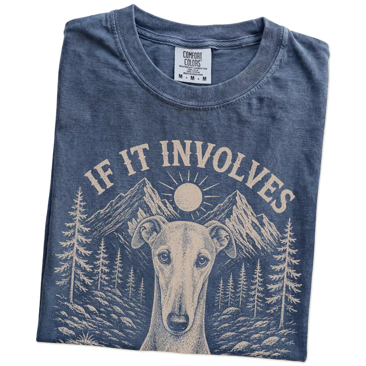 Folded Denim Comfort Colors® T-shirt showing Greyhound hiking design with mountain scenery