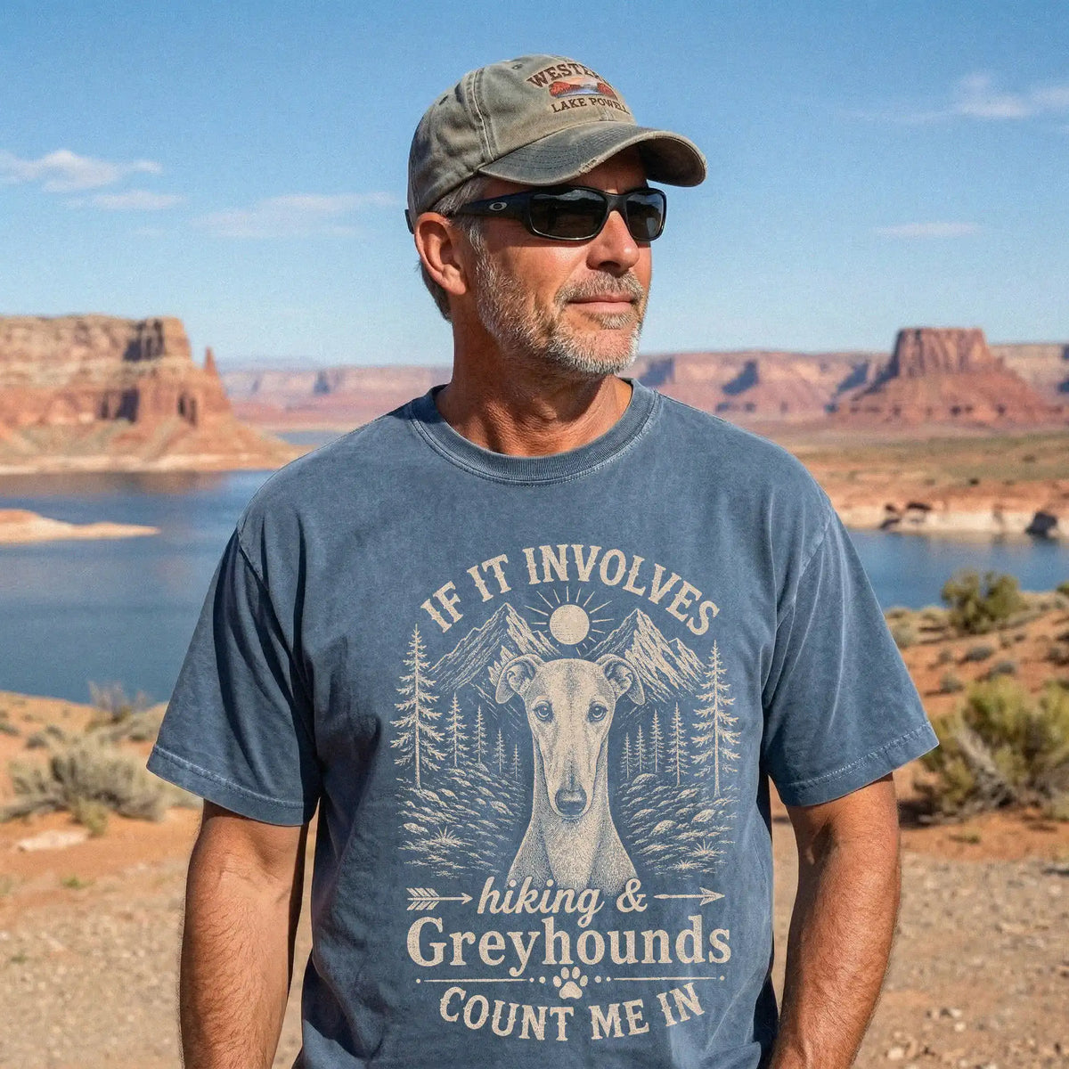 Model wearing a Denim Comfort Colors® T-shirt featuring Greyhound hiking design with mountain scenery