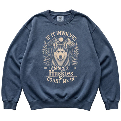 Denim Comfort Colors® sweatshirt featuring Hiking and Huskies, laid-flat presentation
