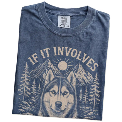 Folded Denim Comfort Colors® T-shirt showing Husky hiking design with mountain scenery