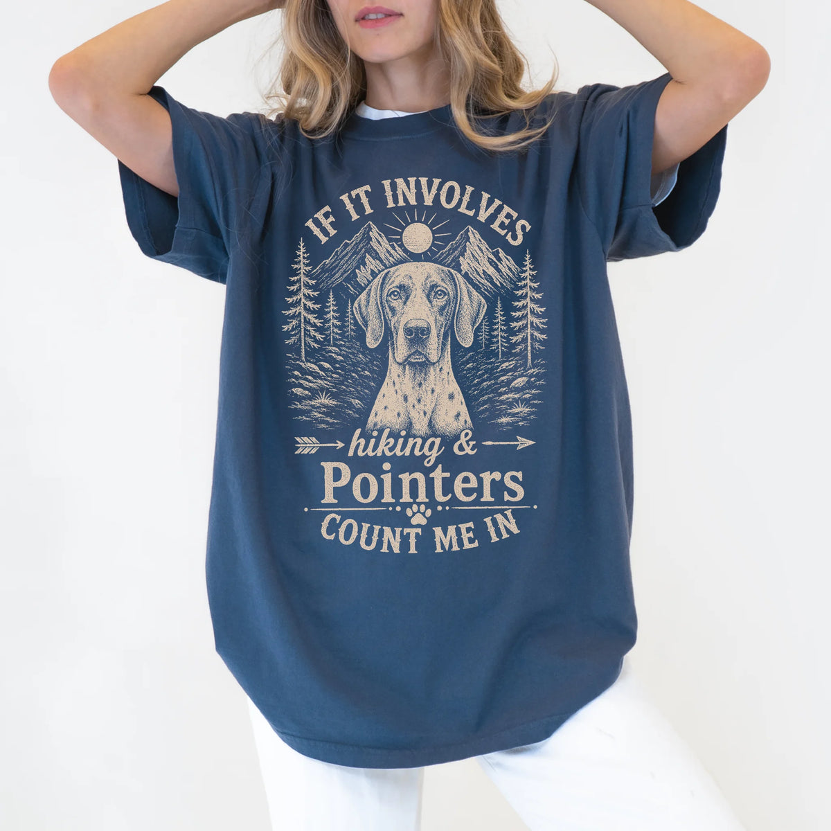 Model wearing a Denim Comfort Colors® T-shirt featuring Pointer hiking design with mountain scenery