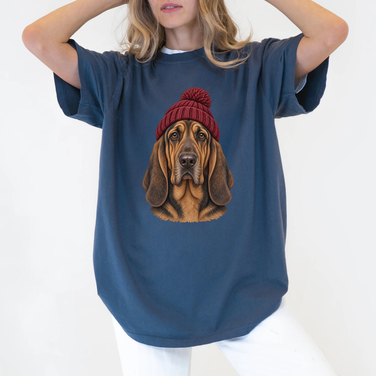 Woman wearing a Denim Bloodhound hipster T-shirt with a maroon-beanie dog portrait