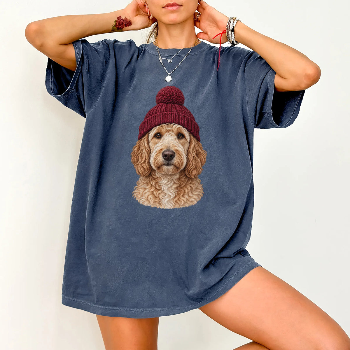 Woman wearing a Denim Goldendoodle hipster T-shirt with a maroon-beanie dog portrait